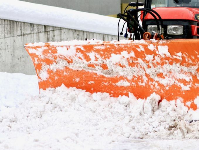 Truck plow pushing snow
